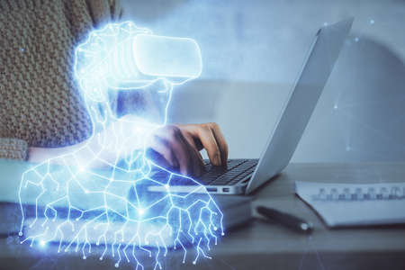 Double exposure of woman hands typing on computer and man in AR glasses drawing. Education concept.の写真素材