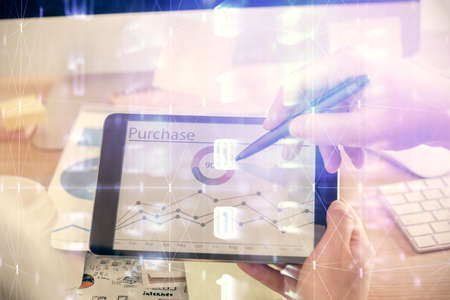 Multi exposure of man's hands holding and using a digital device and data theme drawing. Innovation concept.の写真素材