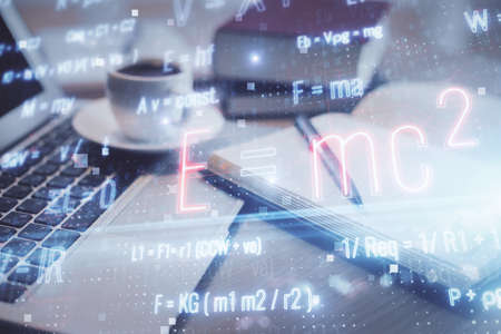 Double exposure of formula drawing and desktop with coffee and items on table background. Concept of...