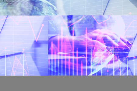 Double exposure of woman hands typing on computer and financial graph hologram drawing. Stock market...