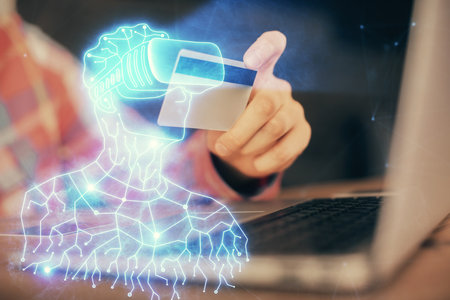 Double exposure of man hands holding a credit card and human in vr glasses drawing. Virtual reality and E-commerce concept.の写真素材