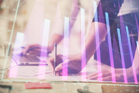 Multi exposure of woman hands typing on computer and financial chart hologram drawing. Stock market analysis concept.の写真素材