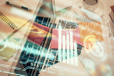 Technology hologram drawing over computer on the desktop background. Top view. Double exposure. Tech concept.の写真素材