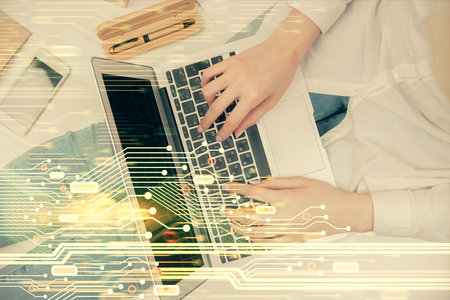 Double exposure of woman hands working on computer and data theme hologram drawing. Top View. Technology concept.の写真素材
