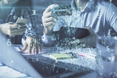 Double exposure of man and woman on-line shopping holding a credit card and data theme hologram...