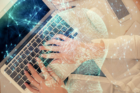 Double exposure of woman working on computer andhuman brain hologram drawing. Top View. Ai concept.の写真素材