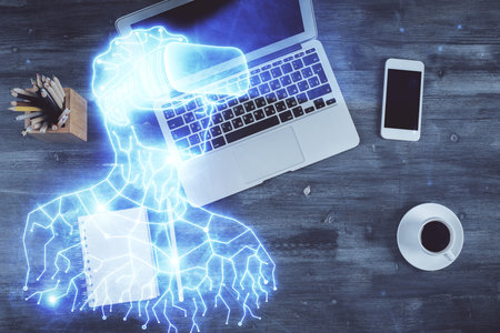 AR hologram drawings over computer on the desktop background. Top view. Multi exposure. Concept of augmented reality.の写真素材