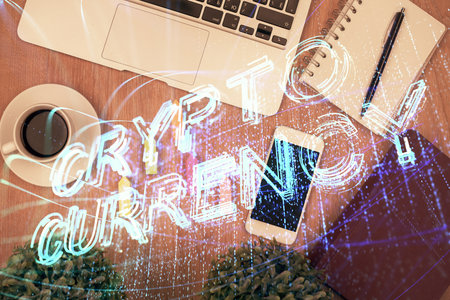 Double exposure of blockchain theme hologram over table with phone. Top view. Crypto technology concept.の写真素材
