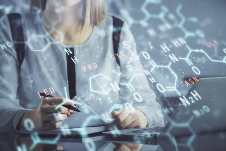 Double exposure of woman hands typing on computer and formula hologram drawing. Education concept.の写真素材