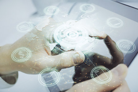 Double exposure of man's hands holding and using a phone and social network theme drawing.