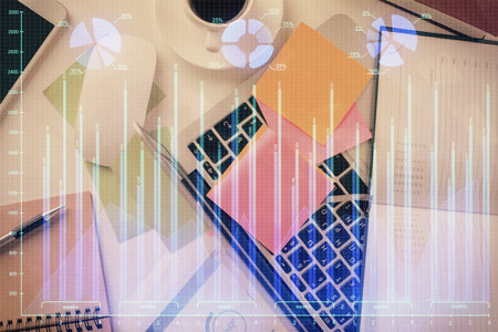 Multi exposure of financial chart drawing over table background with computer. Concept of research and analysis. Top view.の写真素材
