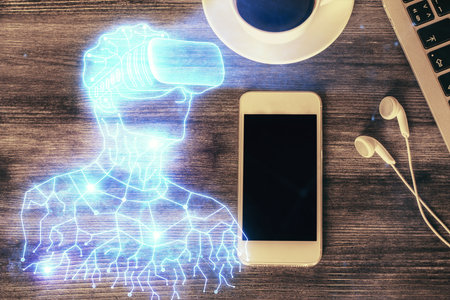 Double exposure of drawing man in AR glasses over table with phone. Top view. VR concept.