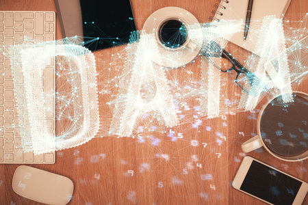 Double exposure of technology theme drawing over work table desktop. Top view. Global data analysis concept.の写真素材