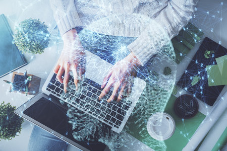 Double exposure of woman working on computer andhuman brain hologram drawing. Top View. Ai concept.の写真素材