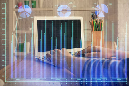 Double exposure of woman hands typing on computer and forex chart hologram drawing. Stock market invest concept.の写真素材