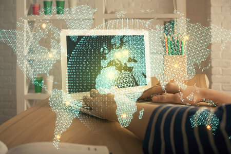 Double exposure of woman hands typing on computer and business theme hologram drawing. Success...