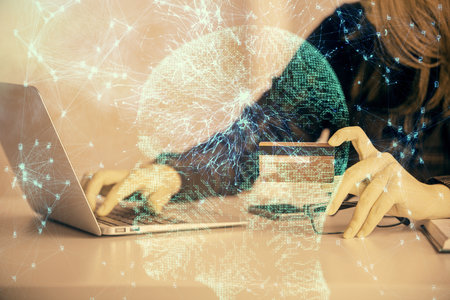 Double exposure of woman on-line shopping holding a credit card and brain hologram drawing. Data E-commerce concept.の写真素材