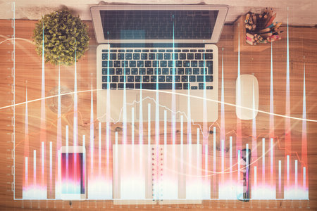 Multi exposure of financial chart drawing over table background with computer. Concept of research. Top view.の写真素材