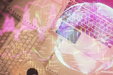 Financial market graph and top view computer on the desktop background. Multi exposure. Investment concept.の写真素材