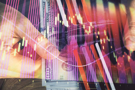 Multi exposure of forex graph drawing hologram and USA dollars bills and man hands. Technical...