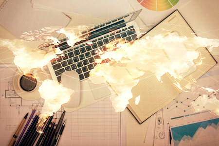 Business theme hologram drawings over computer on the desktop background. Top view. Multi exposure. Concept of international connections.の写真素材