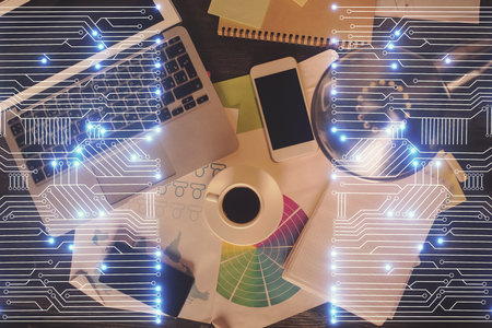 Technology hologram drawing over computer on the desktop background. Top view. Double exposure. Tech concept.の写真素材