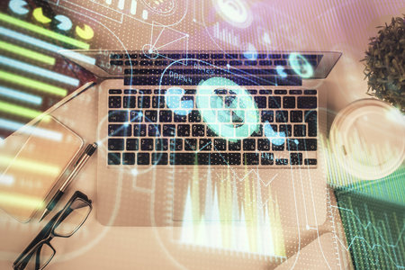 Double exposure of data theme drawing hologram over topview work table background with computer....