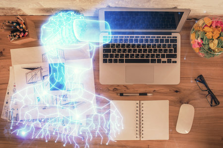 AR hologram drawings over computer on the desktop background. Top view. Multi exposure. Concept of augmented reality.の写真素材
