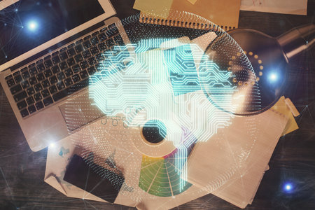 Double exposure of brain drawing hologram over topview work table background with computer. Concept...