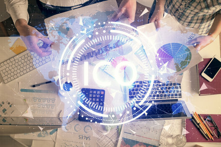 Double exposure of man and woman working together and crypto theme hologram drawing. Computer background. Blockchain concept. Top View.の写真素材