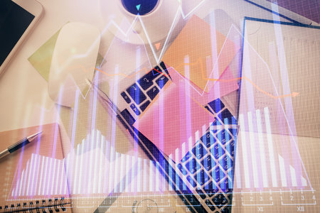 Multi exposure of financial chart drawing over table background with computer. Concept of research and analysis. Top view.の写真素材
