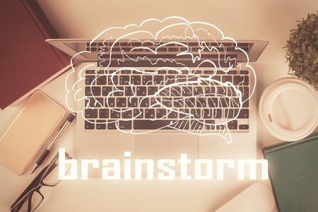 Start up theme drawing over computer on the desktop background. Top view. Double exposure. Brainstorm concept.の写真素材