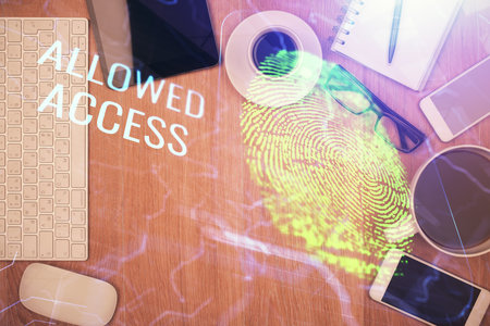 Double exposure of finger print over table with phone. Top view. Concept of mobile security.