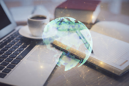 Double exposure of social network drawing and desktop with coffee and items on table background. Concept of international connection.の写真素材
