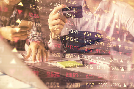 Double exposure of man and woman on-line shopping holding a credit card and forex graph hologram...