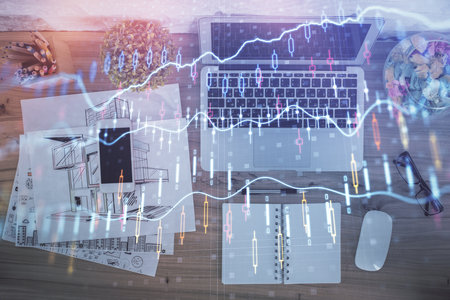 Multi exposure of financial chart drawing over table background with computer. Concept of research. Top view.の写真素材