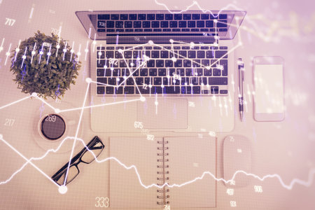 Multi exposure of forex chart drawing over table background with computer. Concept of financial research and analysis. Top view.の写真素材