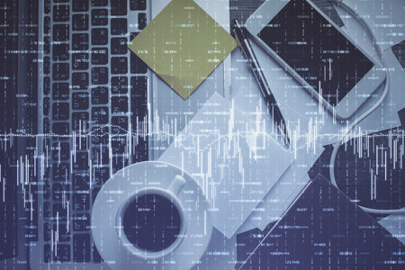 Double exposure of financial chart drawing over table background with computer. Concept of research...