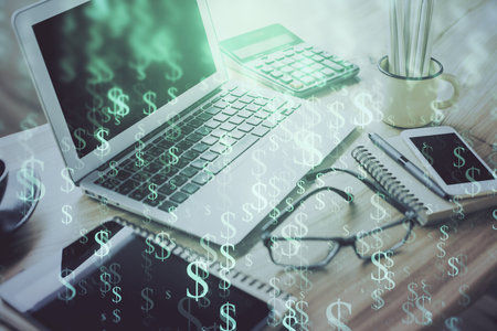 Stock market graph on background with desk and personal computer. Double exposure. Concept of financial analysis.の写真素材