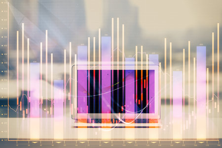 Stock market graph on background with desk and personal computer. Double exposure. Concept of financial analysis.の写真素材