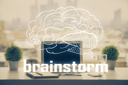 Desktop computer background in office and start up theme hologram drawing. Double exposure. Startup concept.の写真素材