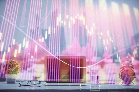 Forex Chart hologram on table with computer background. Multi exposure. Concept of financial markets.の写真素材