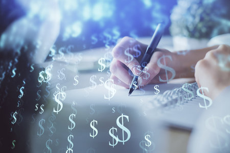 Financial forex graph displayed on hands taking notes background. Concept of research. Multi exposureの写真素材