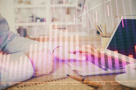Multi exposure of stock market chart with man working on computer on background. Concept of financial analysis.の写真素材