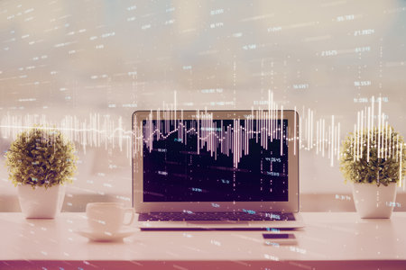 Stock market graph on background with desk and personal computer. Double exposure. Concept of financial analysis.の写真素材