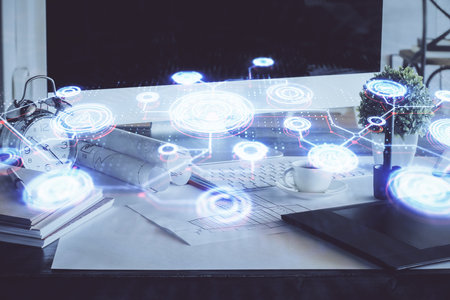 Computer on desktop with social network hologram. Double exposure. Concept of international people connections.の写真素材