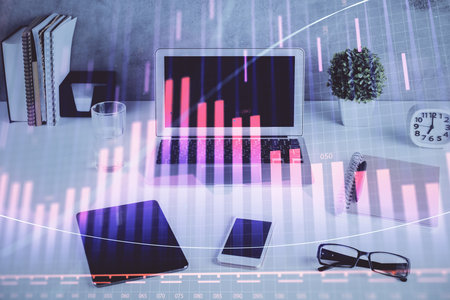 Stock market graph and table with computer background. Double exposure. Concept of financial analysis.の写真素材