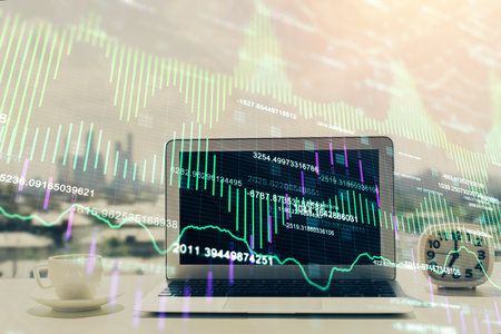 Stock market graph and table with computer background. Double exposure. Concept of financial analysis.の写真素材