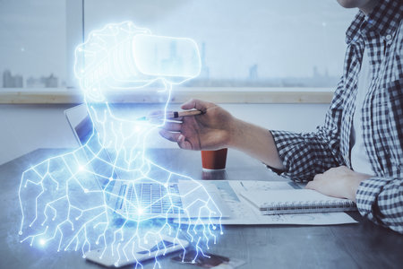 AR hologram with man working on computer on background. Augmented reality concept. Double exposure.