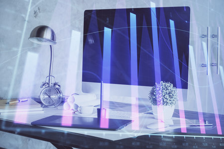 Forex Chart hologram on table with computer background. Double exposure. Concept of financial markets.の写真素材